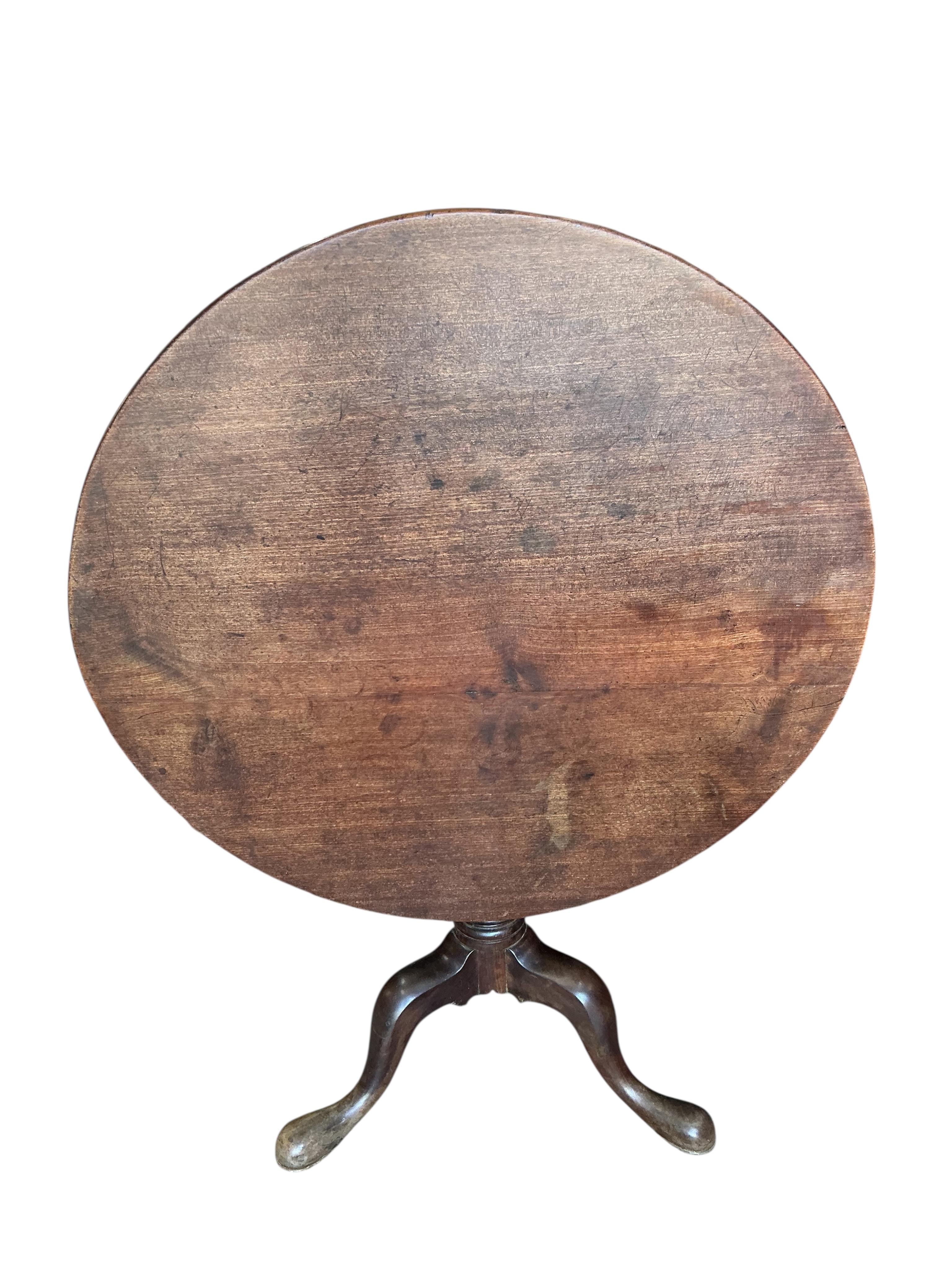 A George III circular mahogany tilt top tripod tea table, diameter 91cm, height 72cm